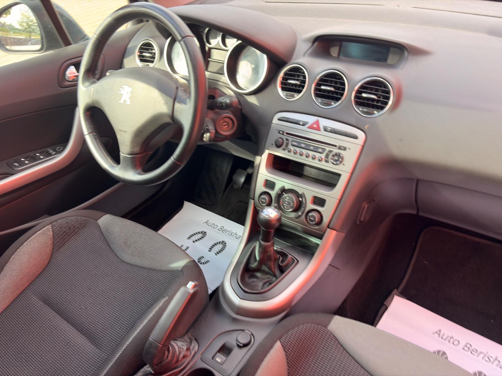 Peugeot 308 2012 — photo 21