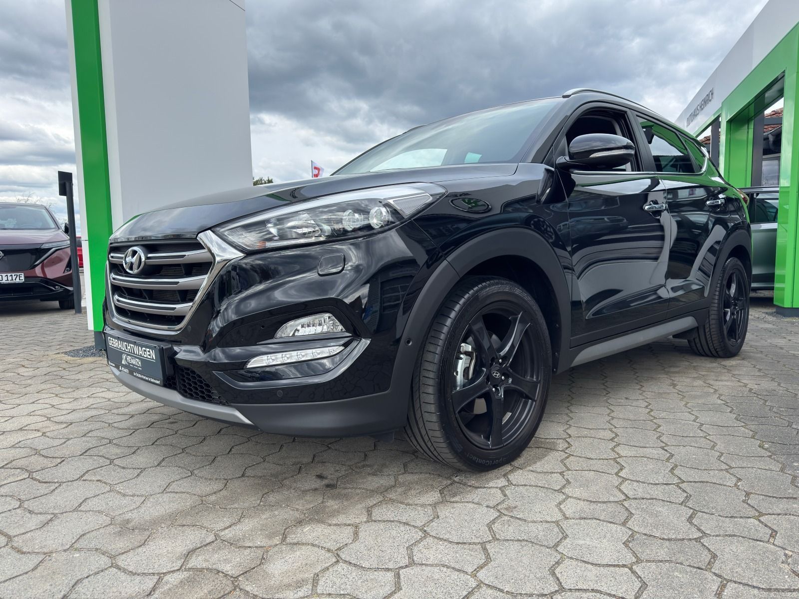 Fahrzeugabbildung Hyundai Tucson 2.0 CRDi 4WD Automatik*RFK*AHK*eHeck*NAVI
