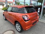 Suzuki Swift 1.2 Dualjet Hybrid 61 kW ALLGrip Comfor... - Suzuki Swift: Orange