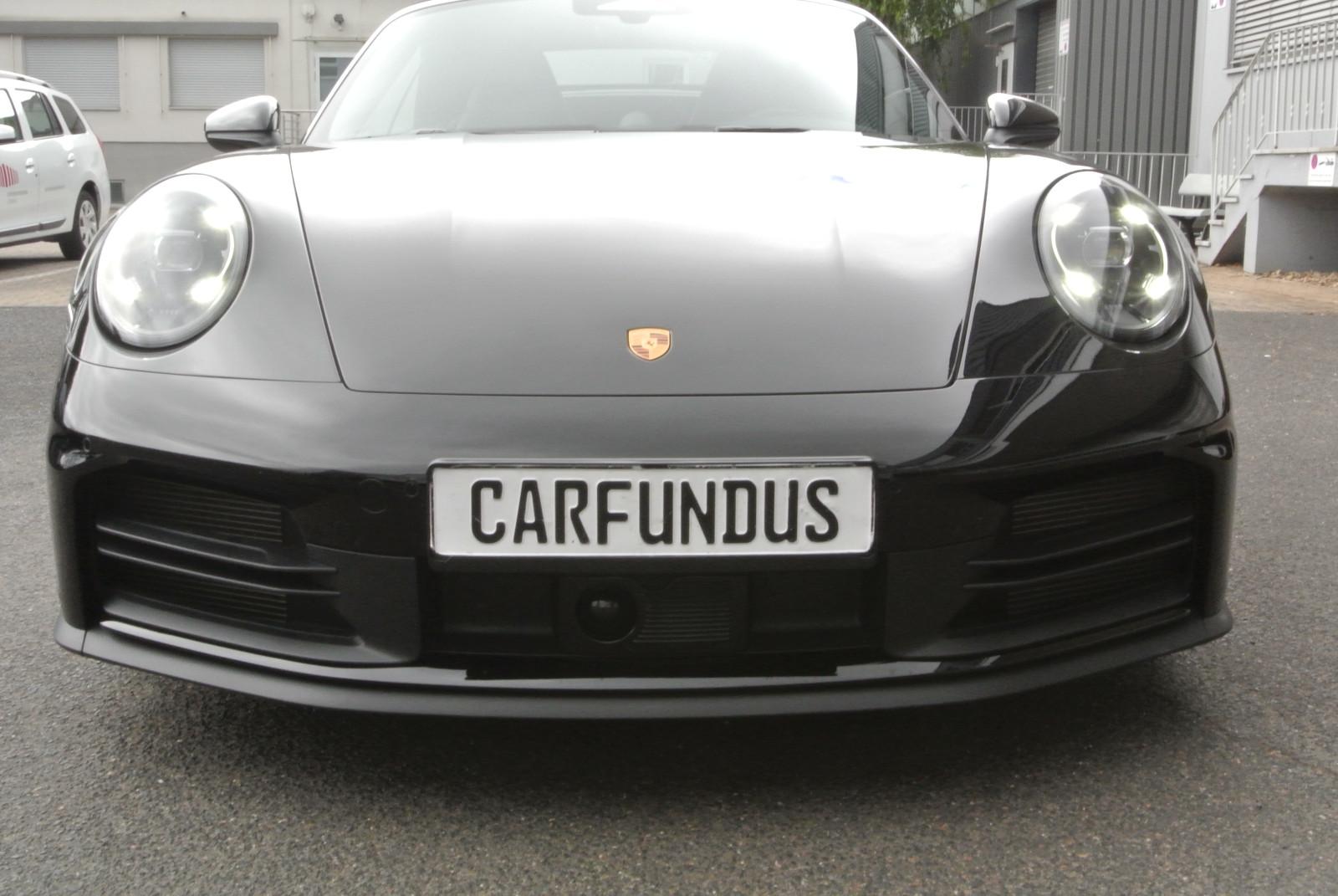 Porsche 992 cab,schw/schw,21",abgas,chrono,bose,acc,sofo