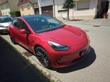 Tesla Model 3 Performance TÜV auf Wunsch neu - rote Tesla Model 3