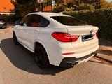 BMW X4 M40i - weiße BMW X4 M40
