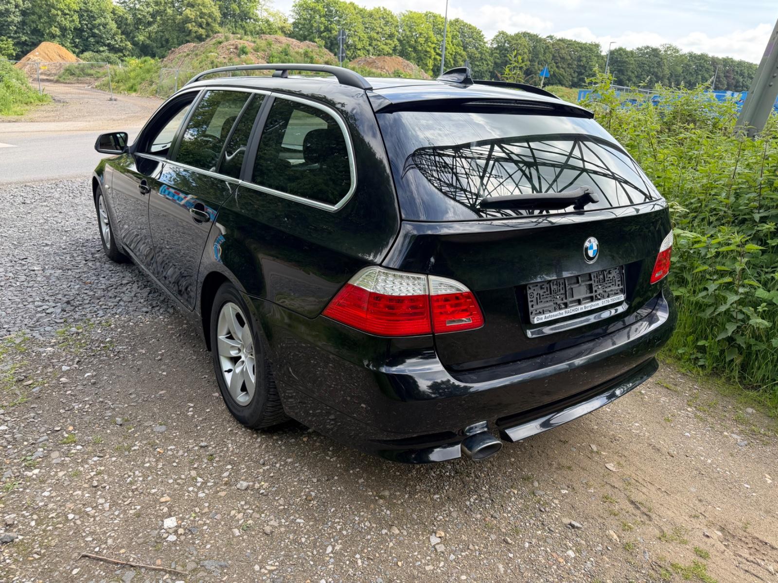 BMW 520 2010 — rear view