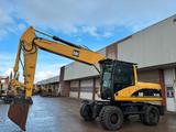 CAT M318C - CAT Mobilbagger 318