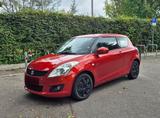 Suzuki Swift 1.2 Klima Allwetter Service Tagfahrlicht - Suzuki Swift mit Benzin-Antrieb: Orange