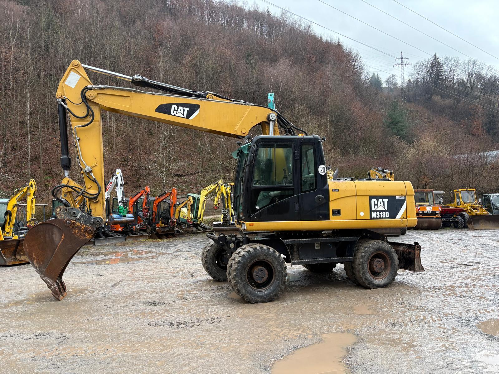 CAT M318D mit Likufix SWA48