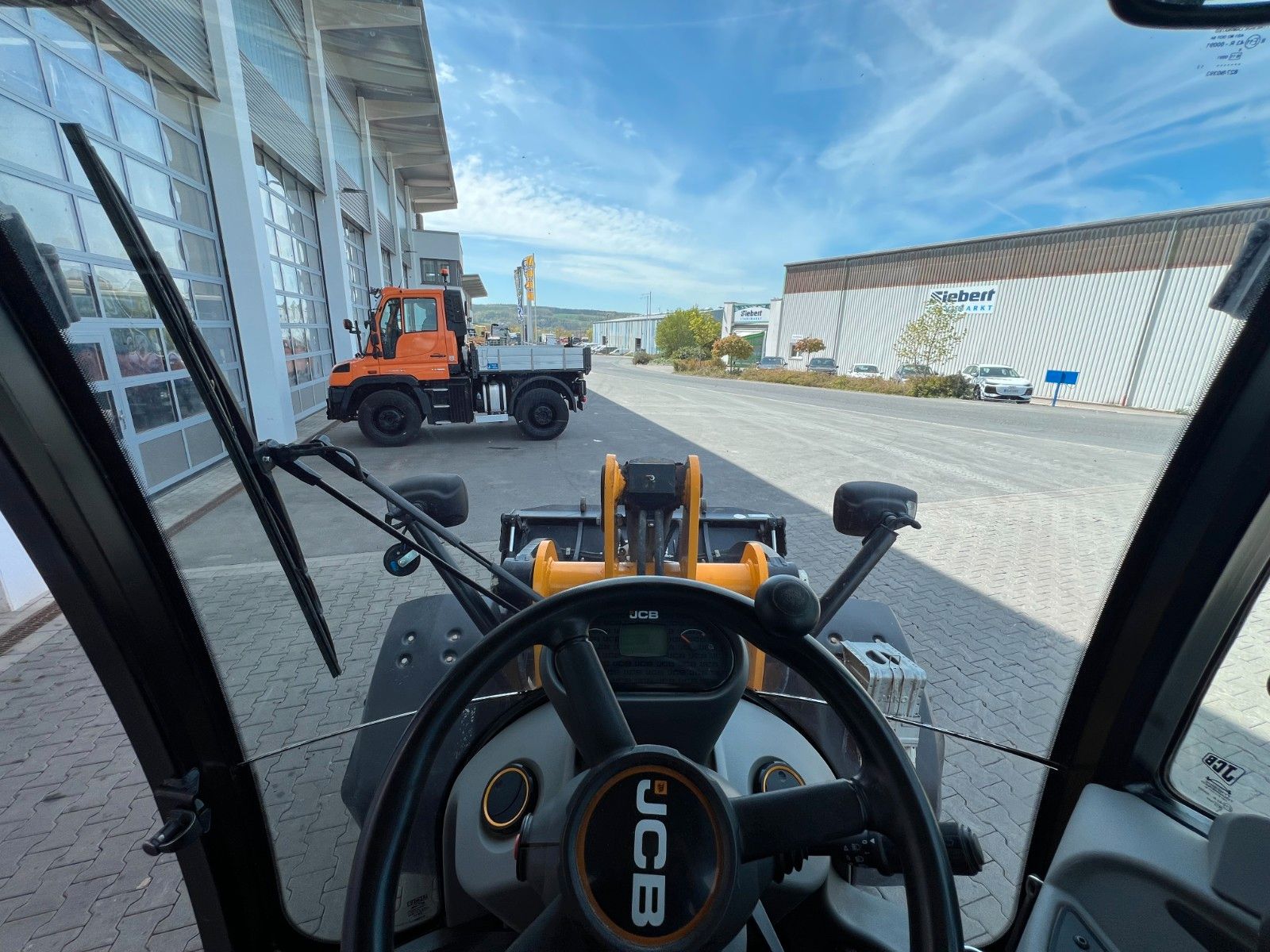 Fahrzeugabbildung JCB 409 SV / nur 2.496h / Klima Klappschaufel Gabel