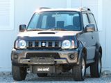 Suzuki Jimny Ranger 4WD 1.3 NAVI/KLIMA/Anhängerk.1 HAND - Suzuki Jimny aus 2012
