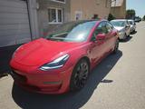 Tesla Model 3 Performance TÜV auf Wunsch neu - rote Tesla Model 3