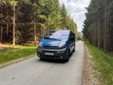 Opel Vivaro Camper-Ausbau: Bett + Regale  - gebrauchte Opel Vivaro aus dem Jahr 2005