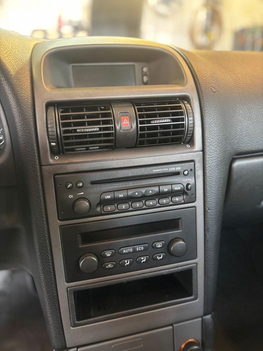 Opel Astra 2004 — photo 14