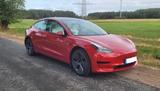 Tesla Model 3 RWD mit Restgarantie, Allwetter - rote Tesla Model 3