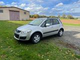 Suzuki SX4 Streetline Club*TÜV NEU*Automatik*AHK*1Hand - silberne Suzuki SX4