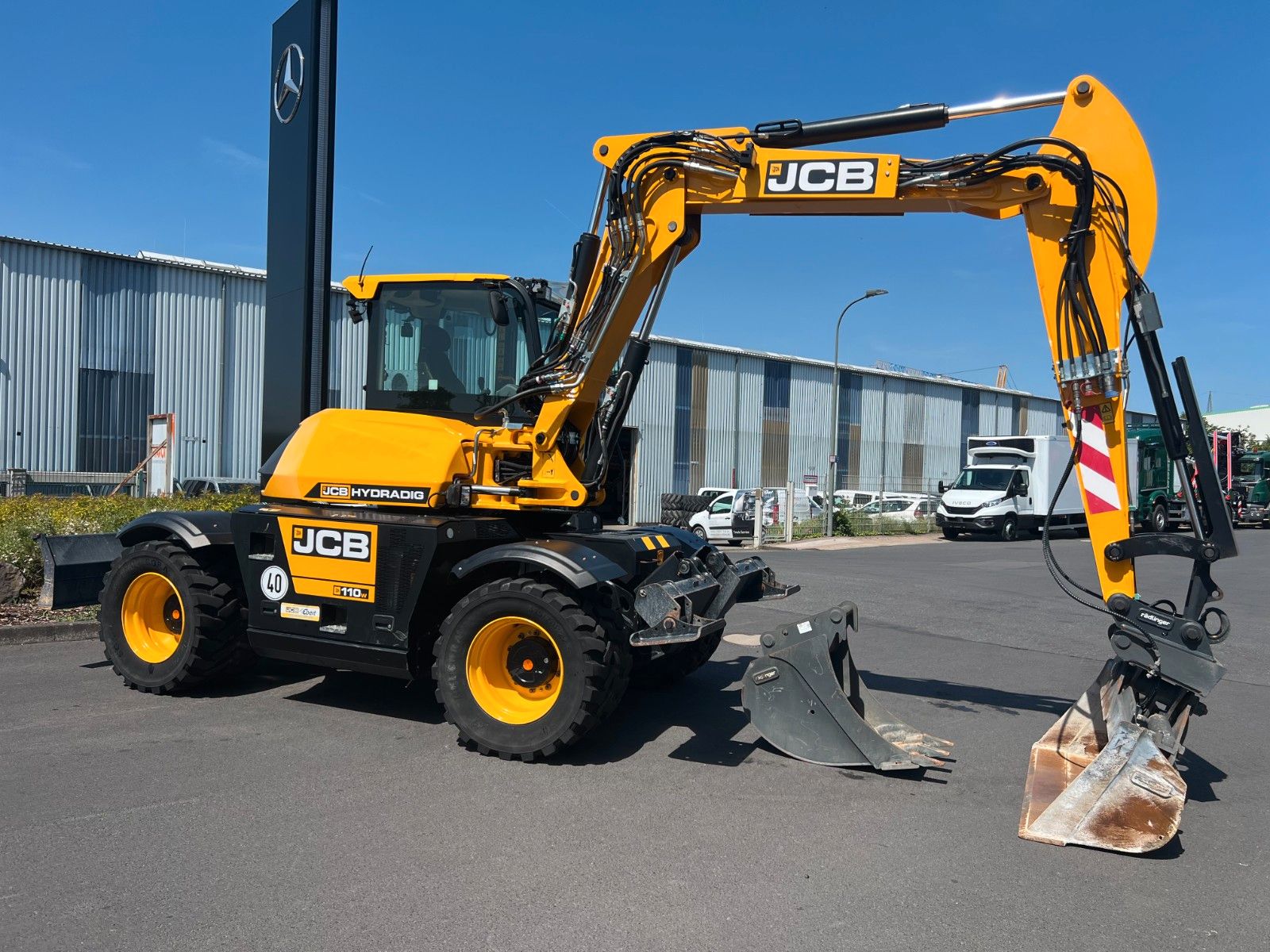 Fahrzeugabbildung JCB Hydradig 110W / Pratzen / nur 179h / Löffelpaket