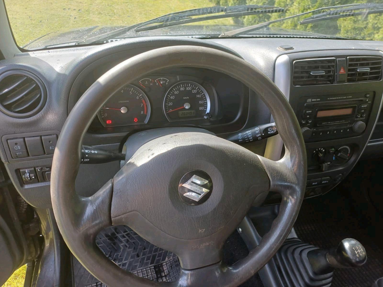 Suzuki Jimny 2010 — фото 15