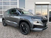 SKODA Karoq 1.5 TSI ACT DSG Sportline PANO AHK 5J GAR bei Autohaus Landmann & Maier OHG