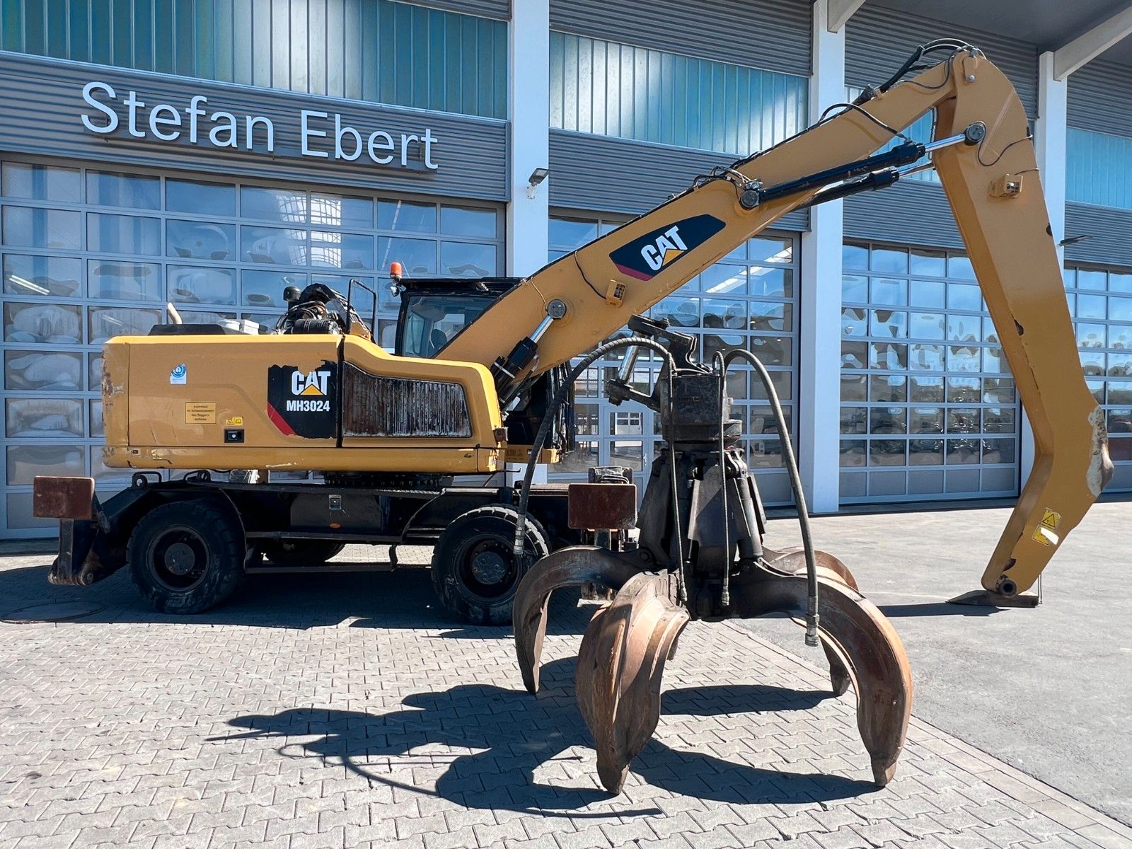 Fahrzeugabbildung CAT MH3024 / Schrottgreifer / 2019 / 9.082h