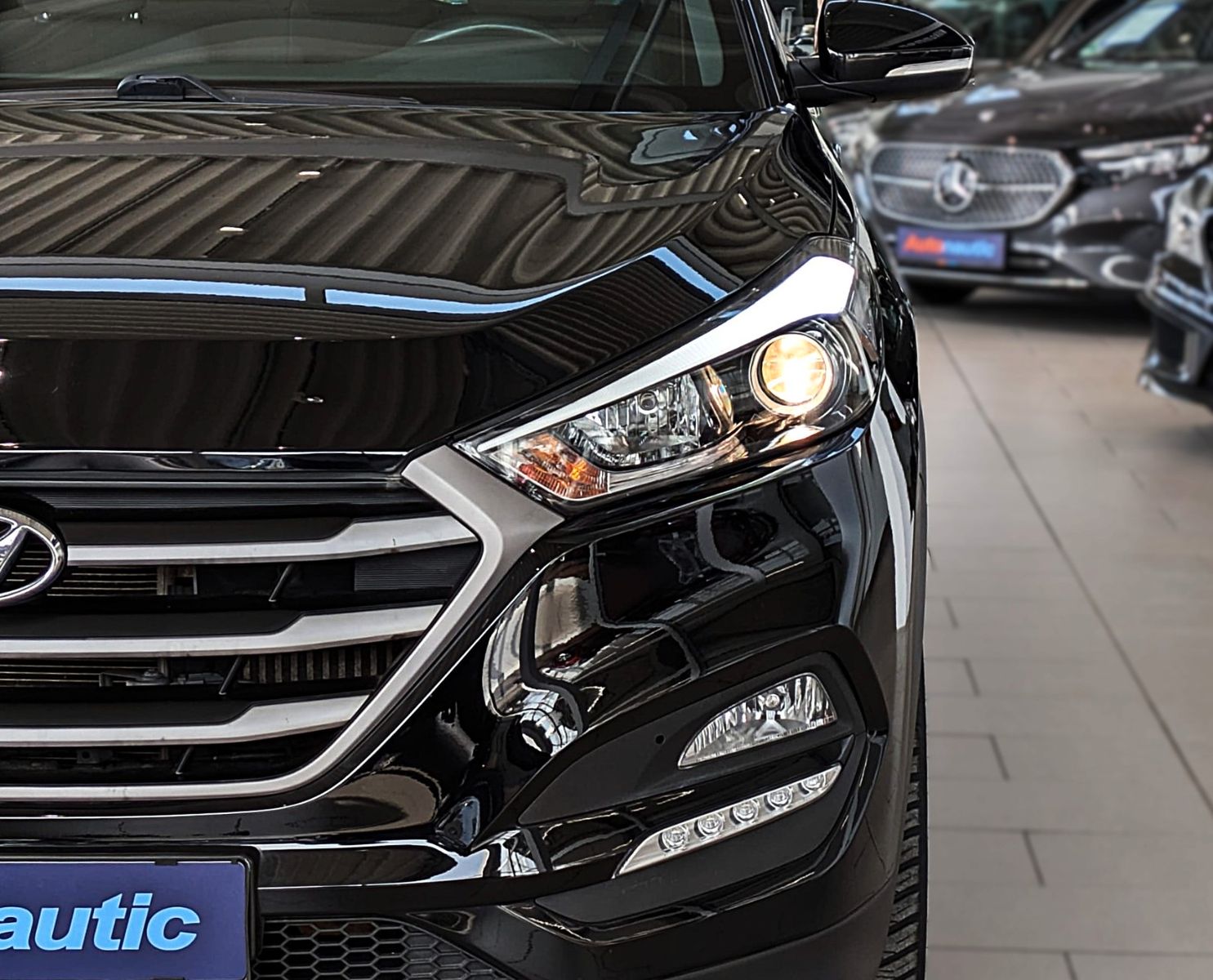 Fahrzeugabbildung Hyundai TUCSON 1.6i DTC PASSION SITZHZ ANDROID NAVI CAM