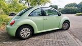 Volkswagen New Beetle 1.6 en vogue en vogue - Volkswagen New Beetle mit Benzin-Antrieb: Limousine, 1.6