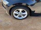 BMW 118i Cabrio + TÜV-bis-11.2025 - BMW 118 mit Benzin-Antrieb: Schwarz, Leder, Cabrio