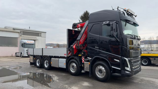 Volvo FH mit Fassi 345 Kran und Pritschenaufbau