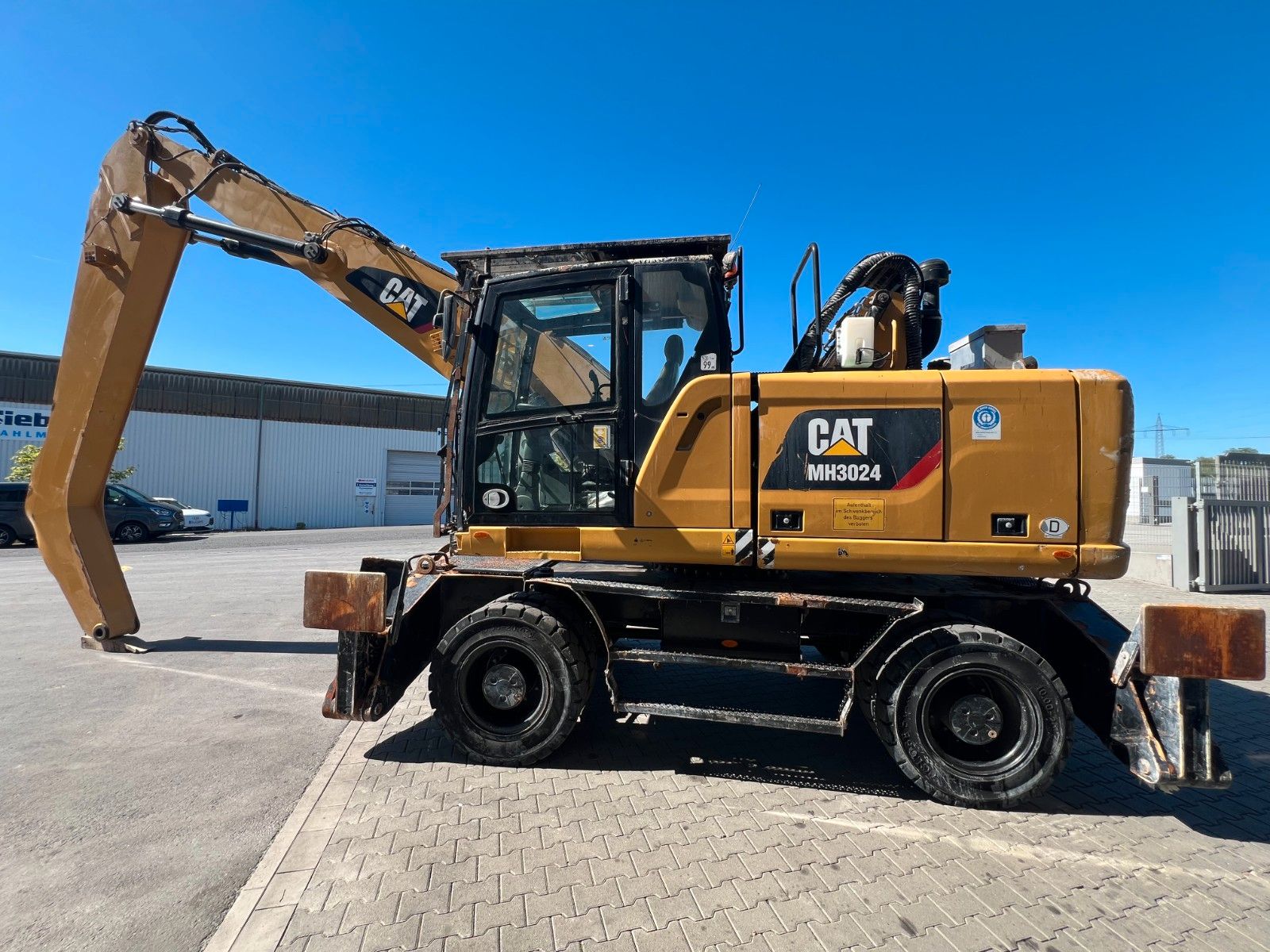 Fahrzeugabbildung CAT MH3024 / Schrottgreifer / 2019 / 9.082h