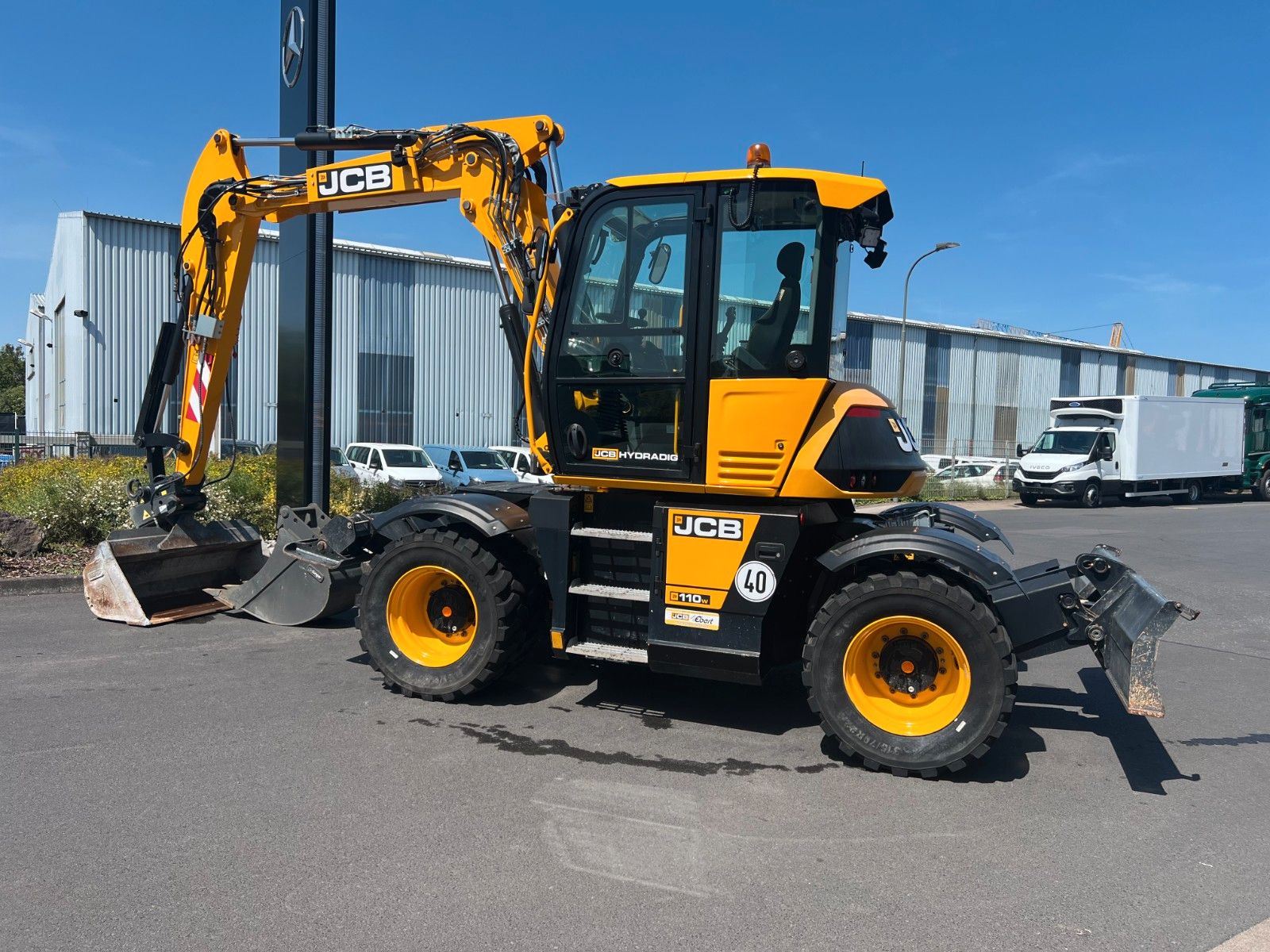 Fahrzeugabbildung JCB Hydradig 110W / Pratzen / nur 179h / Löffelpaket