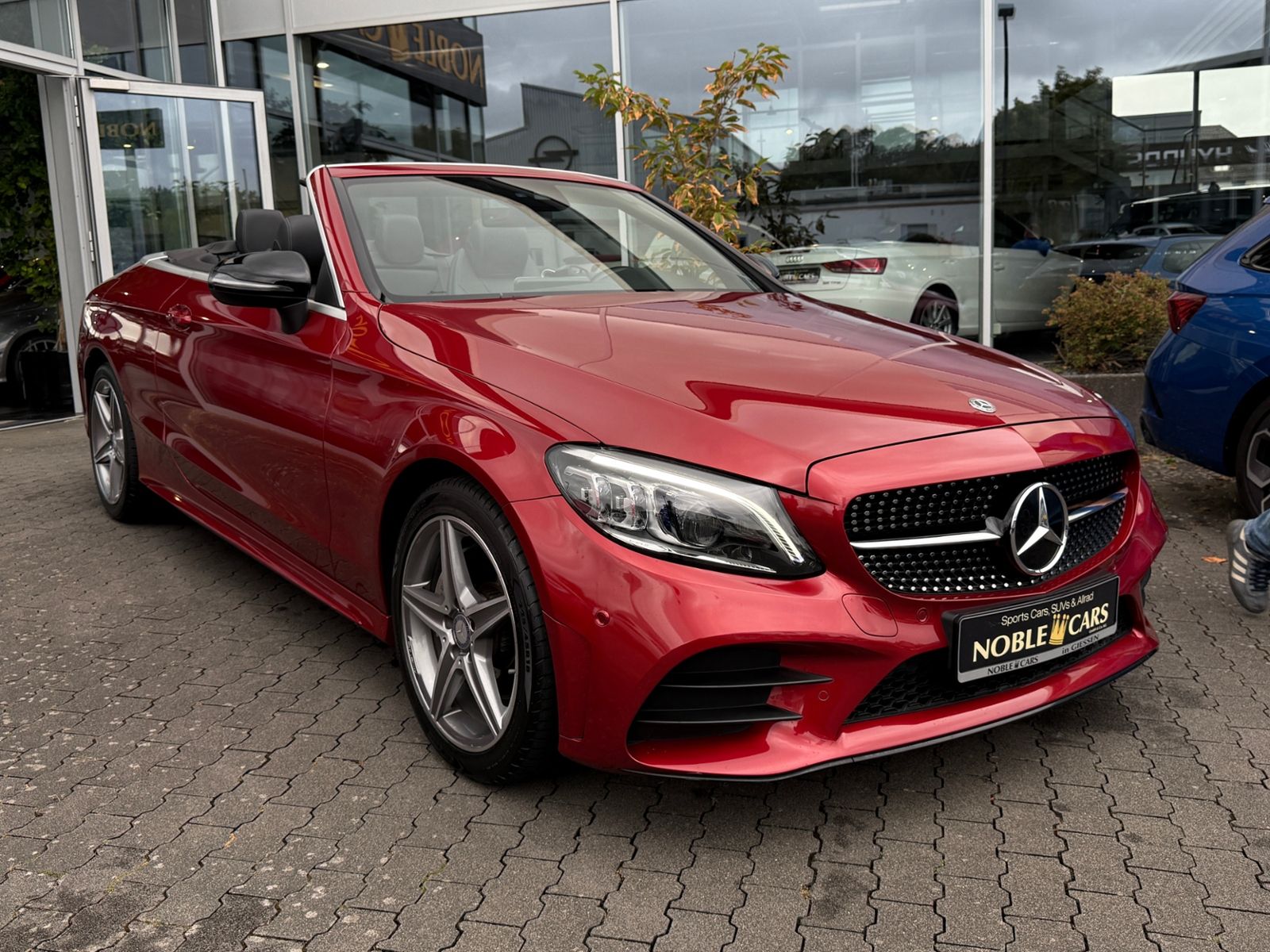 Fahrzeugabbildung Mercedes-Benz C 200 Cabrio AMG NIGHT Navi Rückfahr KAM Sounds.