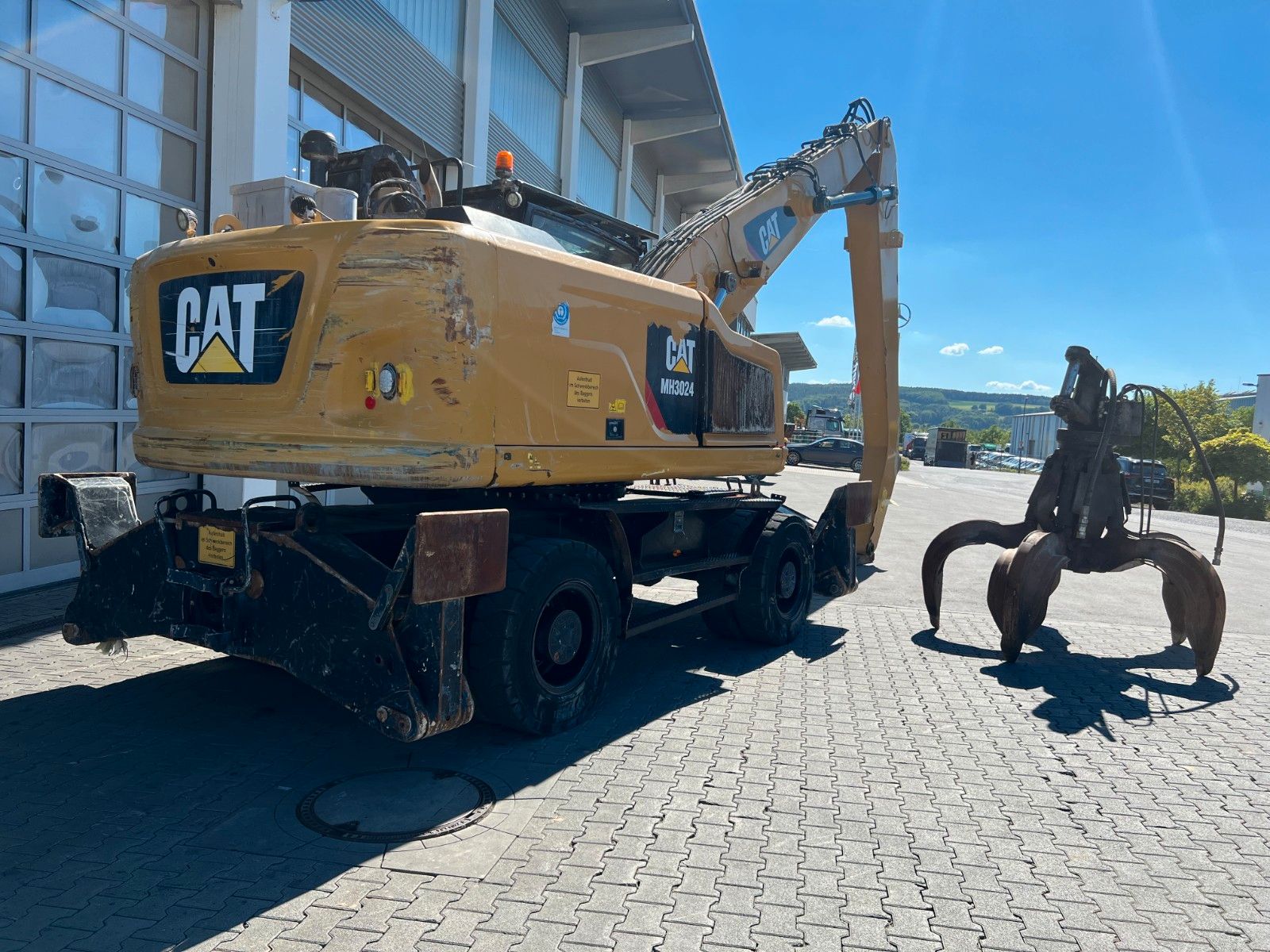 Fahrzeugabbildung CAT MH3024 / Schrottgreifer / 2019 / 9.082h