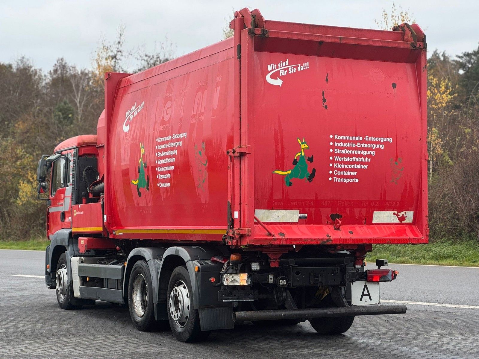 Fahrzeugabbildung MAN TGA 26.320 B/L  6x2 Faun Seitenlader Müllwagen