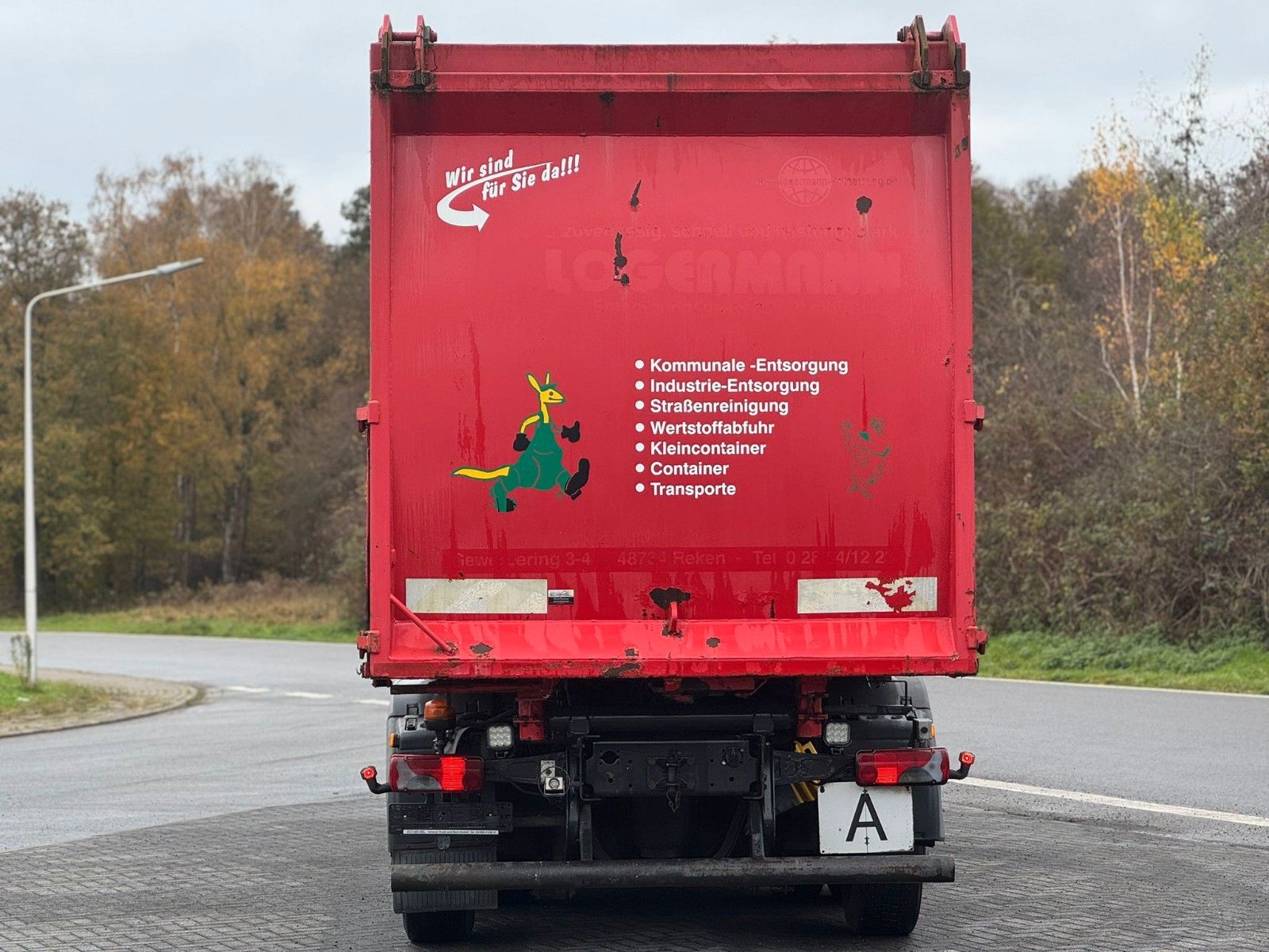 Fahrzeugabbildung MAN TGA 26.320 B/L  6x2 Faun Seitenlader Müllwagen