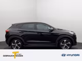 Hyundai Tucson 1,6l Style 8 fach bereift auf LM Felgen - : Schwarz, Felge