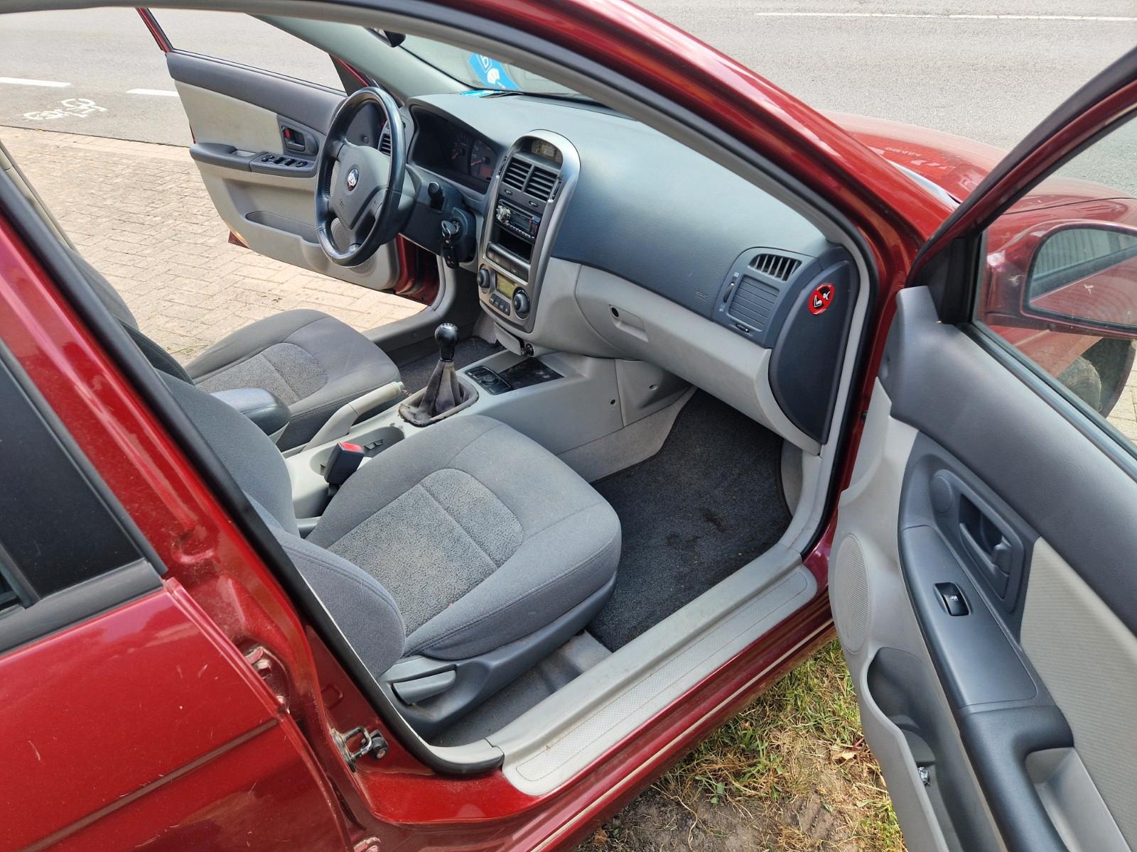 Kia Cerato 2005 — photo 12