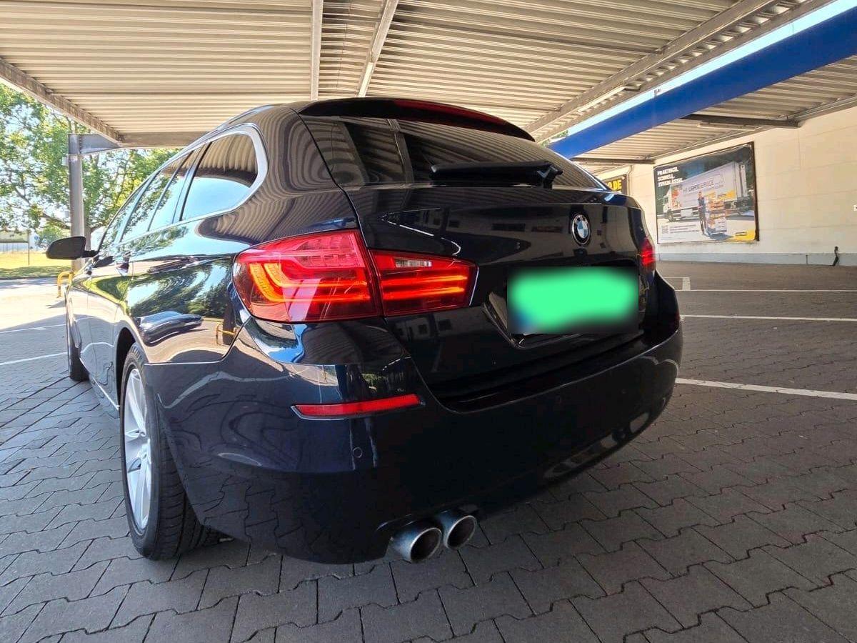BMW 520 2013 — rear view