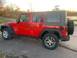 Jeep Wrangler Unlimited Sport 2.8 CRD Sport - Jeep Wrangler: Rot