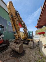 CAT 318CL - CAT Mobilbagger 318
