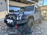 Jeep Wrangler Unlimited Sport|AHK|Winde|Nav|1.Hand - graue Jeep Wrangler